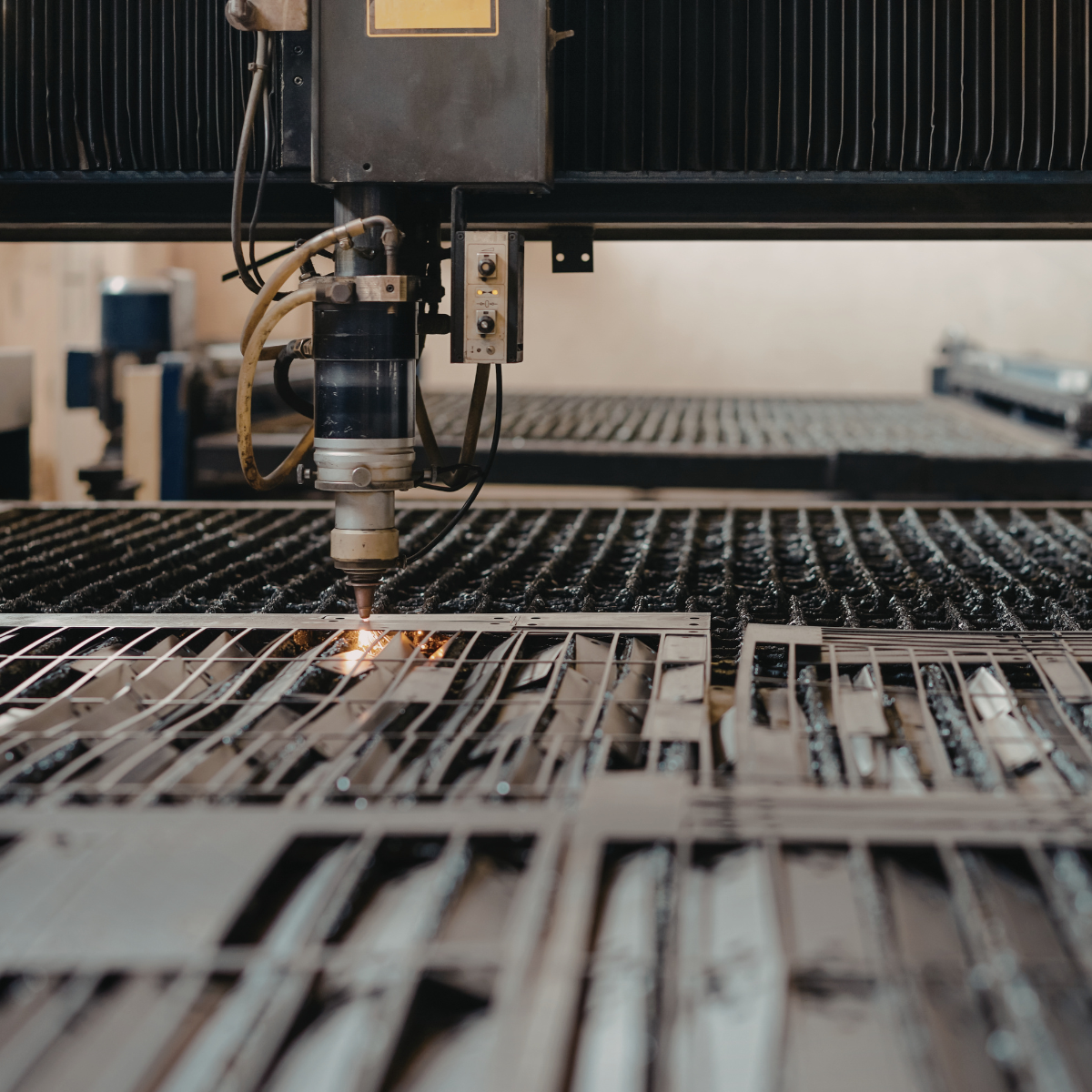 Laser cutting machine precisely cutting a sheet metal part
